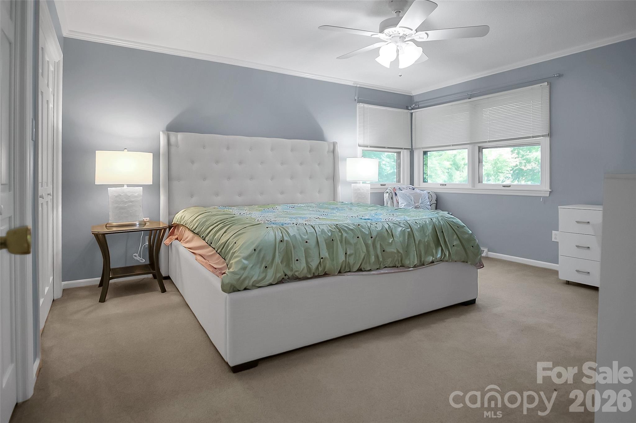 808 Old Mt Holly Road Stanley, NC 28164 - Photo 16 of 48 a bedroom with a bed and a chandelier