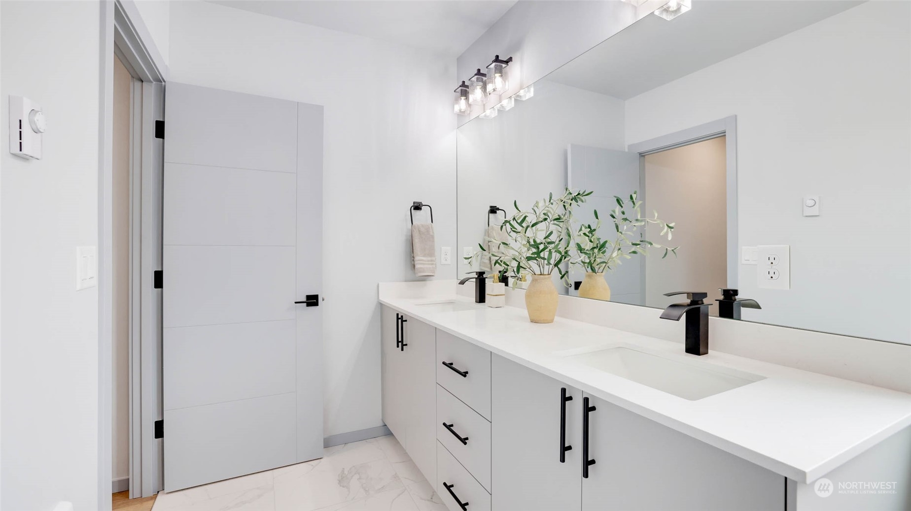 1713 14th Avenue South Seattle, WA 98144 - Photo 14 of 26 a bathroom with a sink a potted plant and a mirror