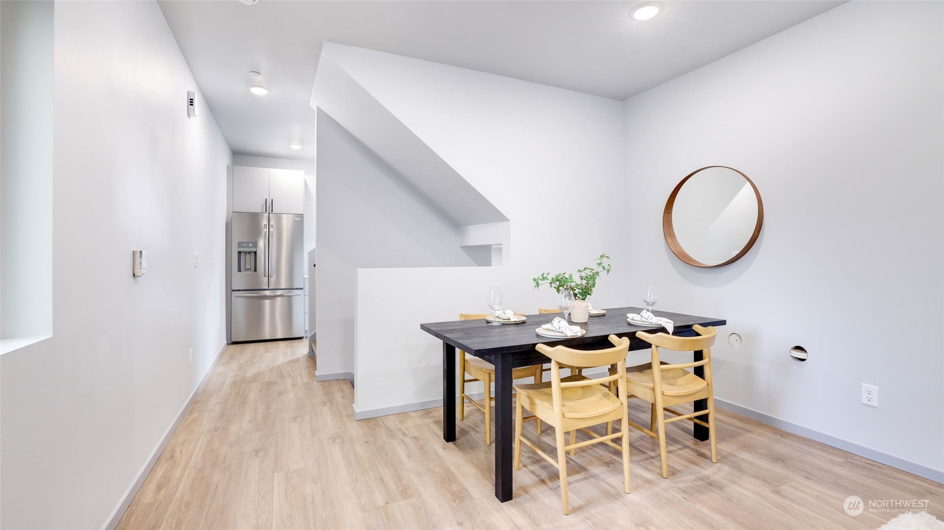 1713 14th Avenue South Seattle, WA 98144 - Photo 7 of 26 a dining room with furniture and a wooden floor