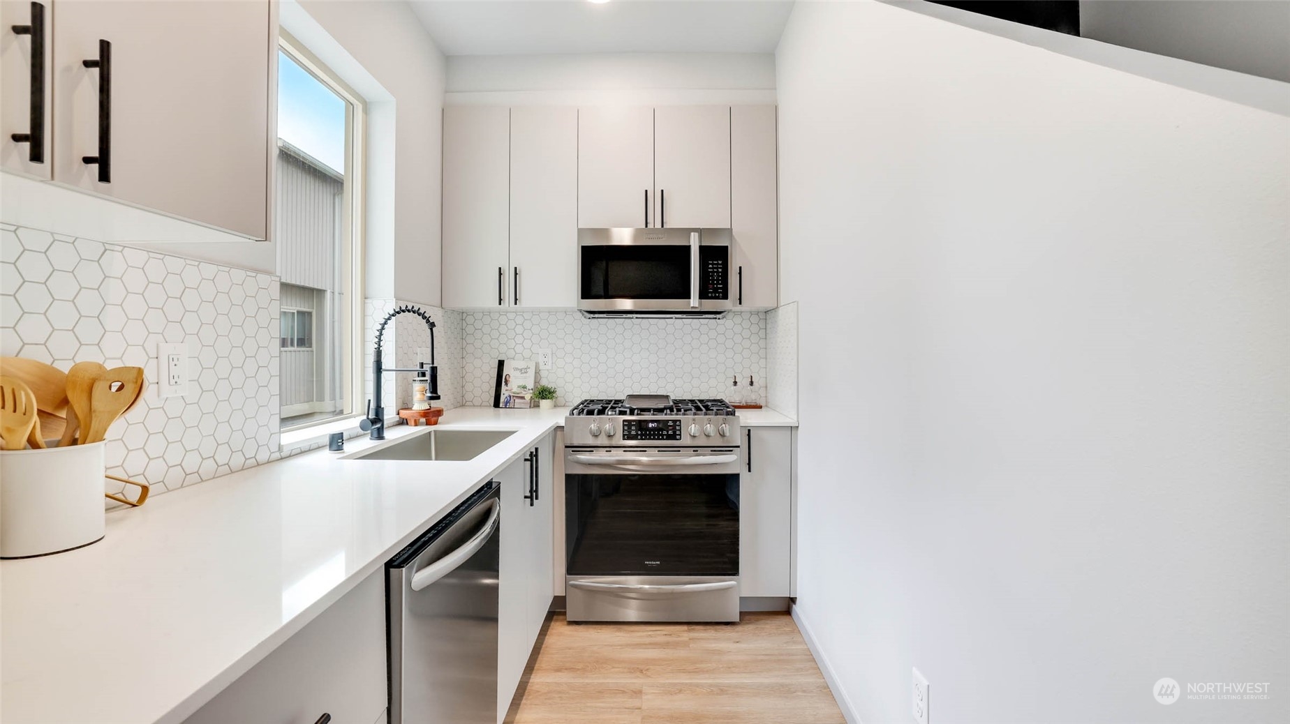 1713 14th Avenue South Seattle, WA 98144 - Photo 9 of 26 a kitchen with a sink and a stove top oven