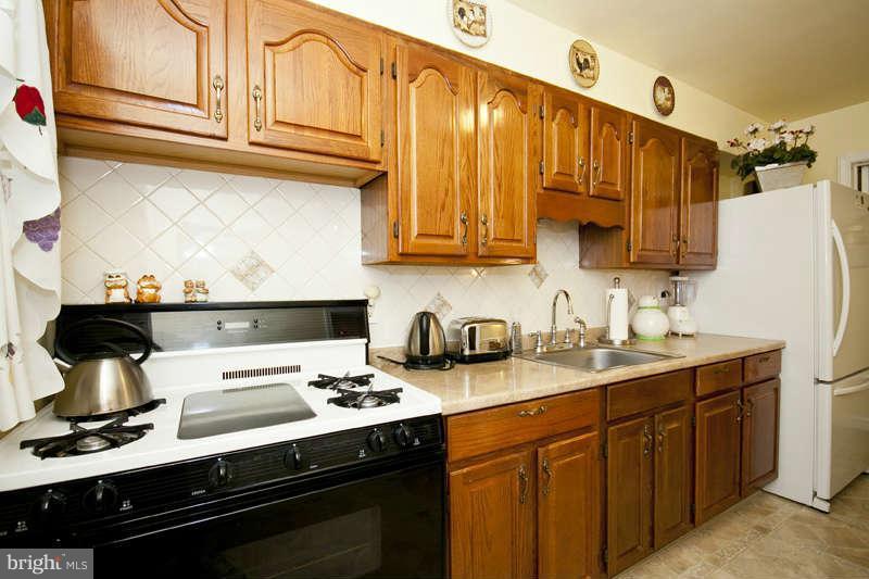 1932 Church Road Baltimore, MD 21222 - Photo 11 of 27 a kitchen with stainless steel appliances granite countertop a sink stove and refrigerator
