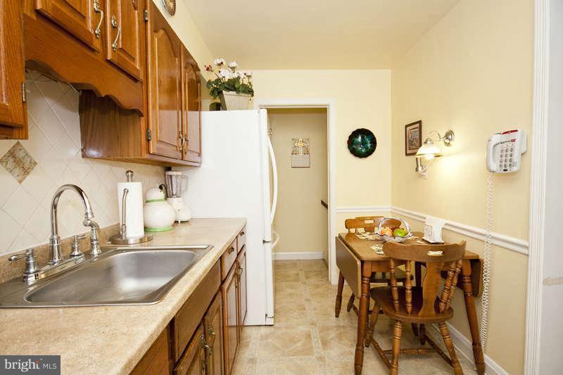 1932 Church Road Baltimore, MD 21222 - Photo 12 of 27 a kitchen with granite countertop a sink and a stove top oven