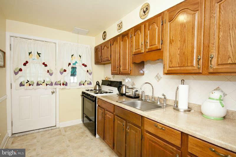 1932 Church Road Baltimore, MD 21222 - Photo 13 of 27 a kitchen with stainless steel appliances granite countertop a sink a stove and refrigerator