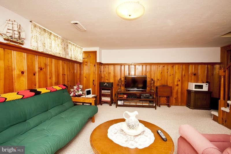 1932 Church Road Baltimore, MD 21222 - Photo 15 of 27 a living room with furniture and a flat screen tv
