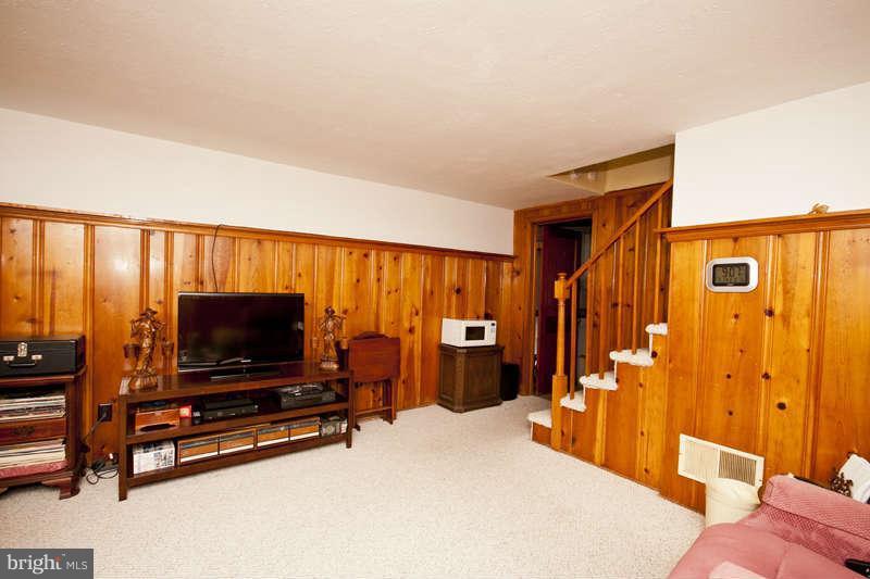1932 Church Road Baltimore, MD 21222 - Photo 16 of 27 a living room with furniture and a flat screen tv