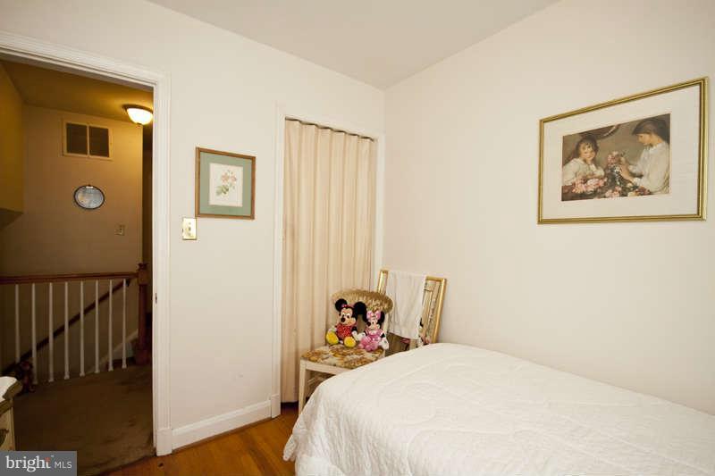 1932 Church Road Baltimore, MD 21222 - Photo 20 of 27 a bedroom with a bed and a painting on the wall