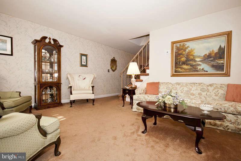 1932 Church Road Baltimore, MD 21222 - Photo 3 of 27 a living room with furniture and a gym machine