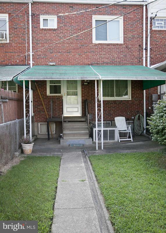1932 Church Road Baltimore, MD 21222 - Photo 24 of 27 a front view of a house with a yard and table