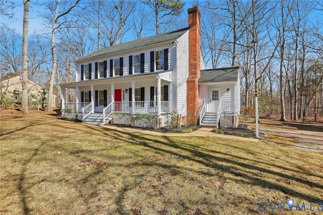 3264 Sherwood Ridge Way Powhatan, VA 23139 - Photo 39 of 40 a front view of a house with a yard