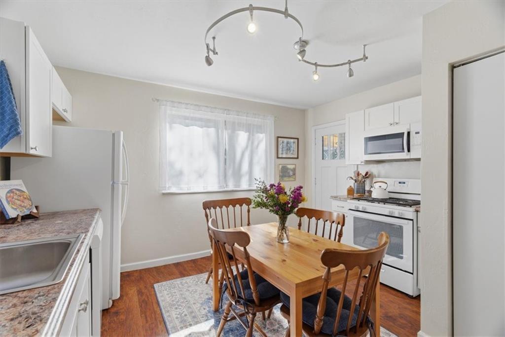 246 Dunseith Street Pittsburgh, PA 15213 - Photo 10 of 36 a view of a dining room with furniture and wooden floor
