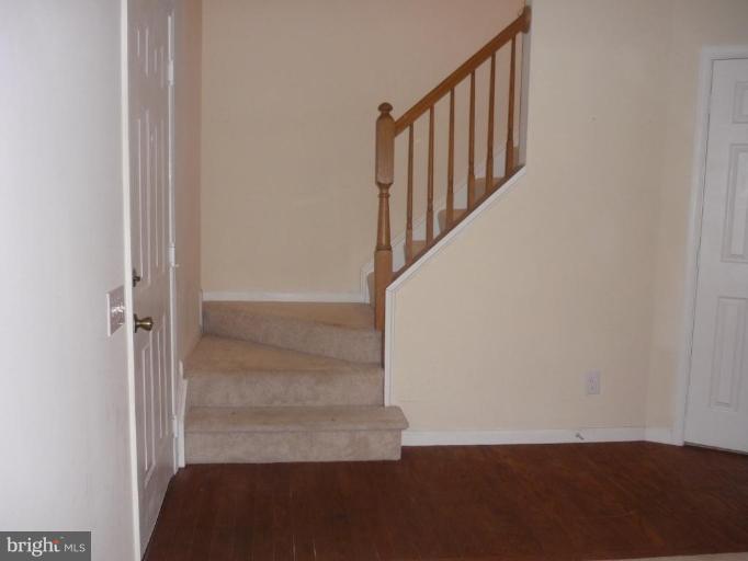 8214 Winstead Place, Unit 204 Manassas, VA 20109 - Photo 7 of 7 a view of entryway with wooden floor