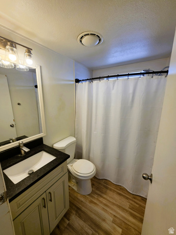 1604 180 East Tooele, UT 84074 - Photo 12 of 16 Second Bathroom featuring a light-toned vanity with dark granite countertop, undermount sink, and brushed nickel faucet