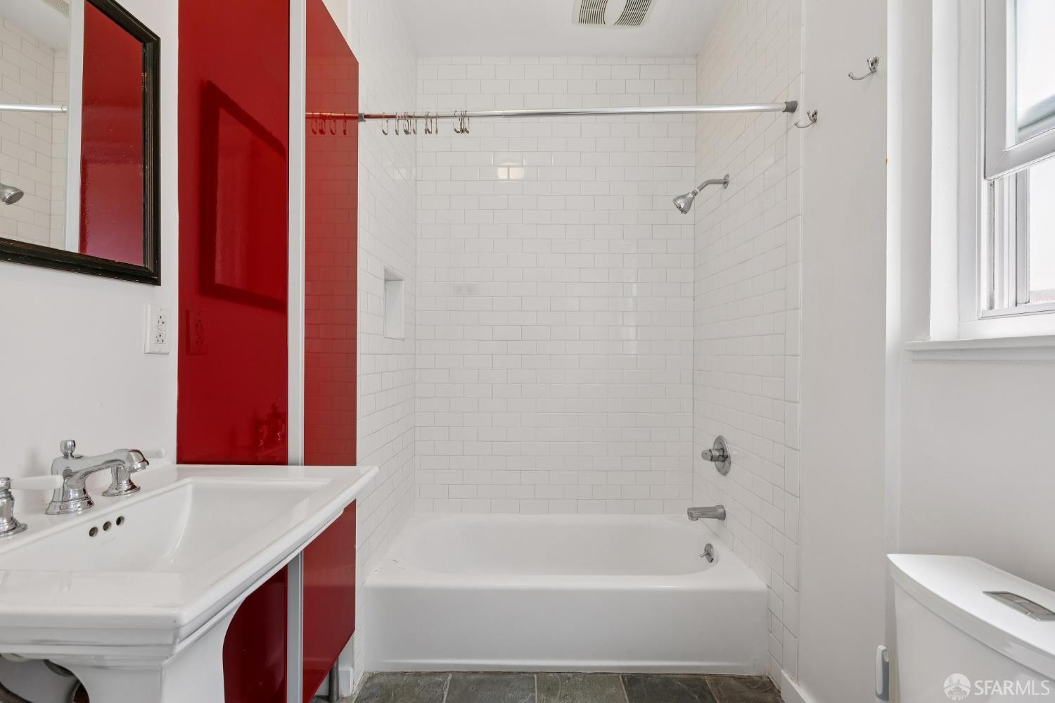 984 Harrison Street San Francisco, CA 94107 - Photo 16 of 34 a bathroom with a bathtub a sink and a shower