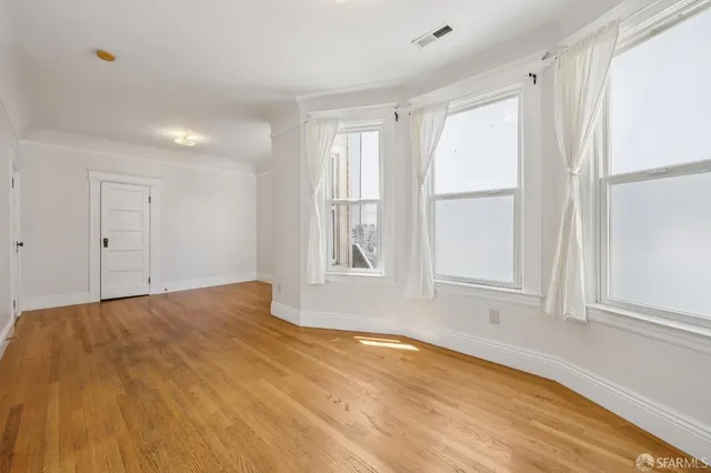 a view of an empty room and window