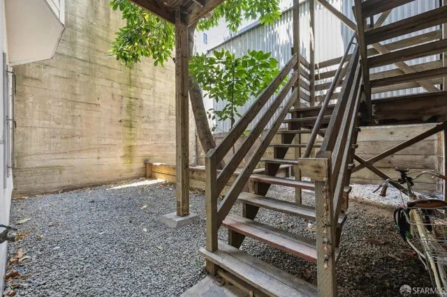 a view of stairs with wooden floor