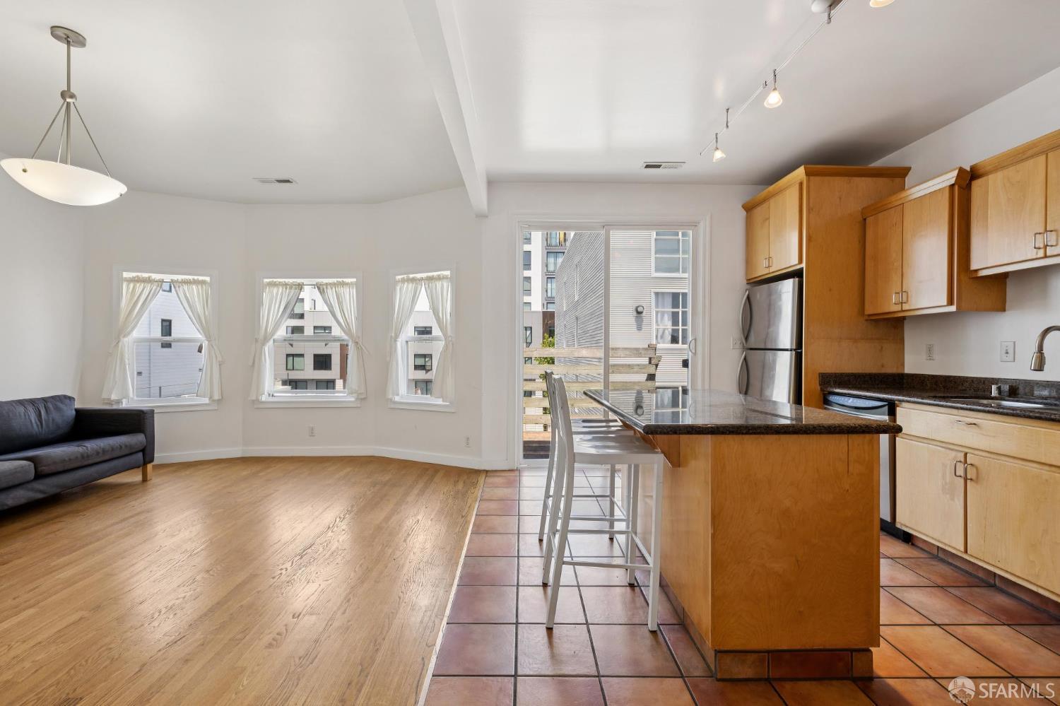 984 Harrison Street San Francisco, CA 94107 - Photo 5 of 34 a kitchen with stainless steel appliances granite countertop a sink and cabinets