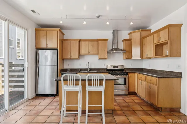 a kitchen with a sink cabinets and stainless steel appliances