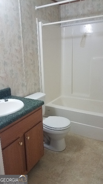 2331 Kesler Road Carnesville, GA 30521 - Photo 44 of 50 a bathroom with a granite countertop bathtub shower sink vanity and toilet