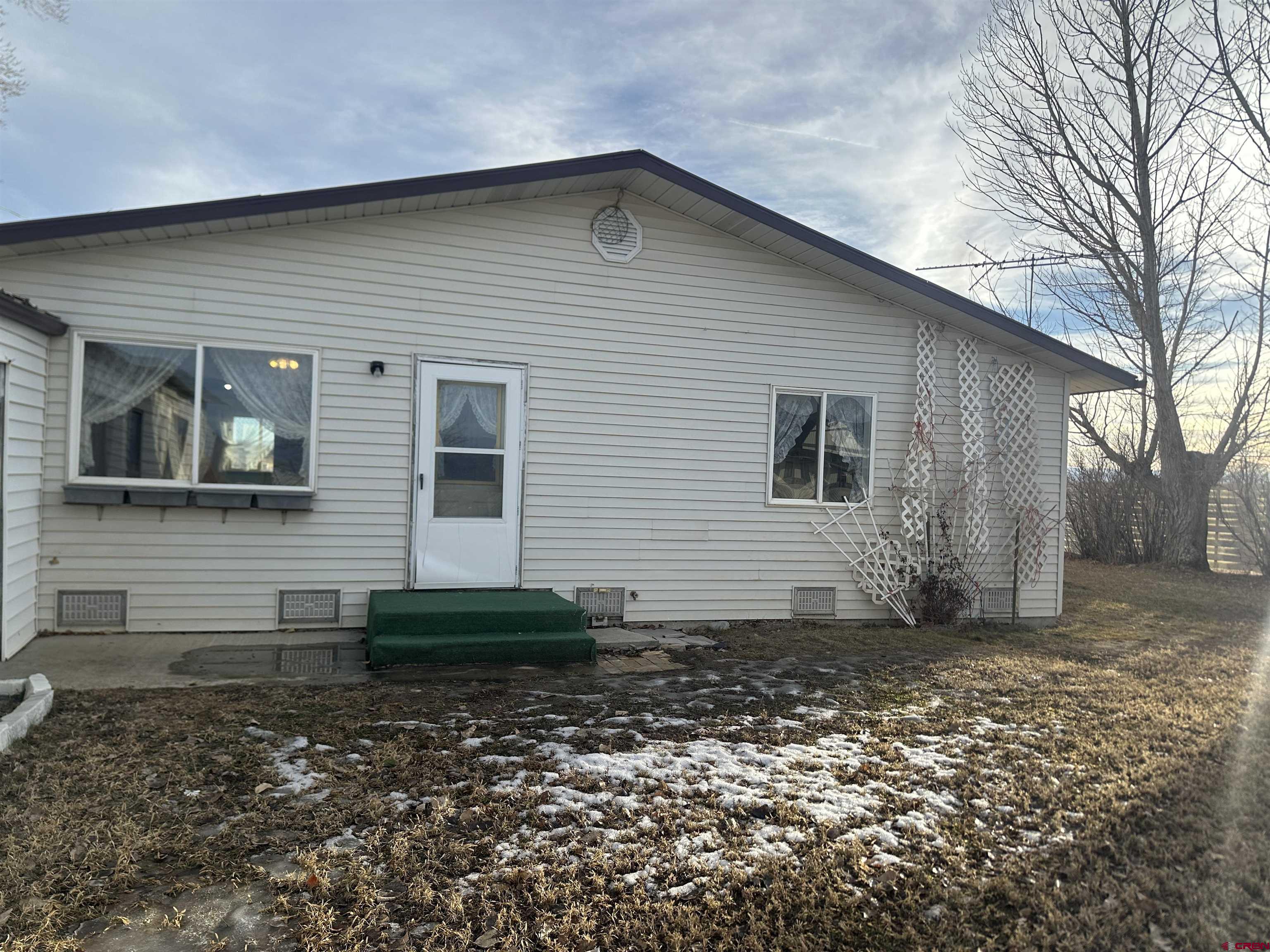 57001 Begonia Road Olathe, CO 81425 - Photo 2 of 37 a front view of a house with garden