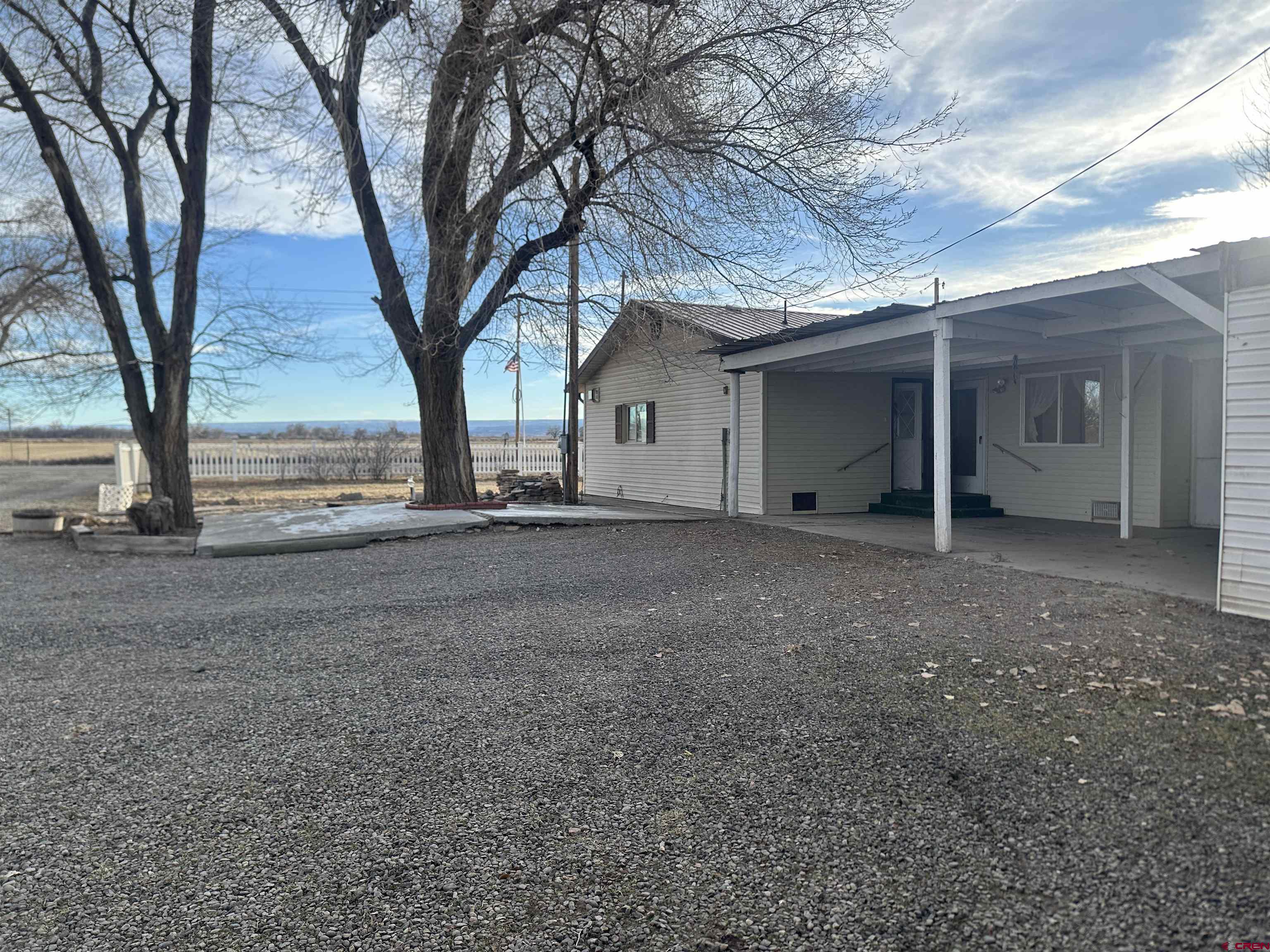 57001 Begonia Road Olathe, CO 81425 - Photo 28 of 37 a view of a house with a tree and a yard