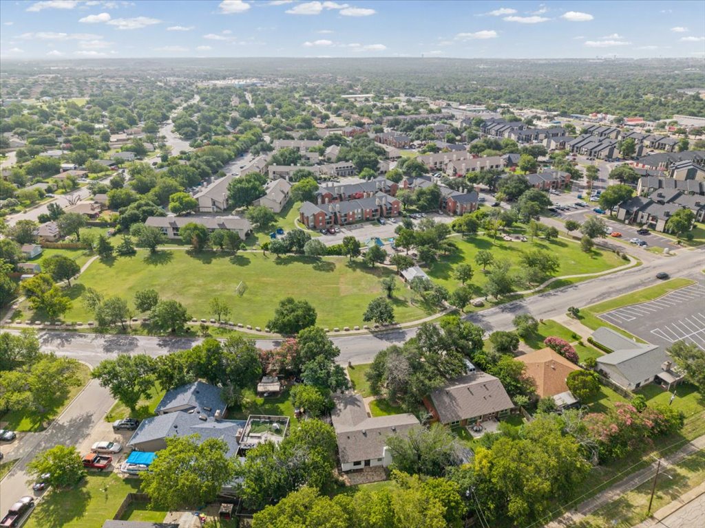 1406 North Georgetown Street Round Rock, TX 78664 - Photo 32 of 34 An aerial perspective reveals a vast community with green spaces and established neighborhoods.