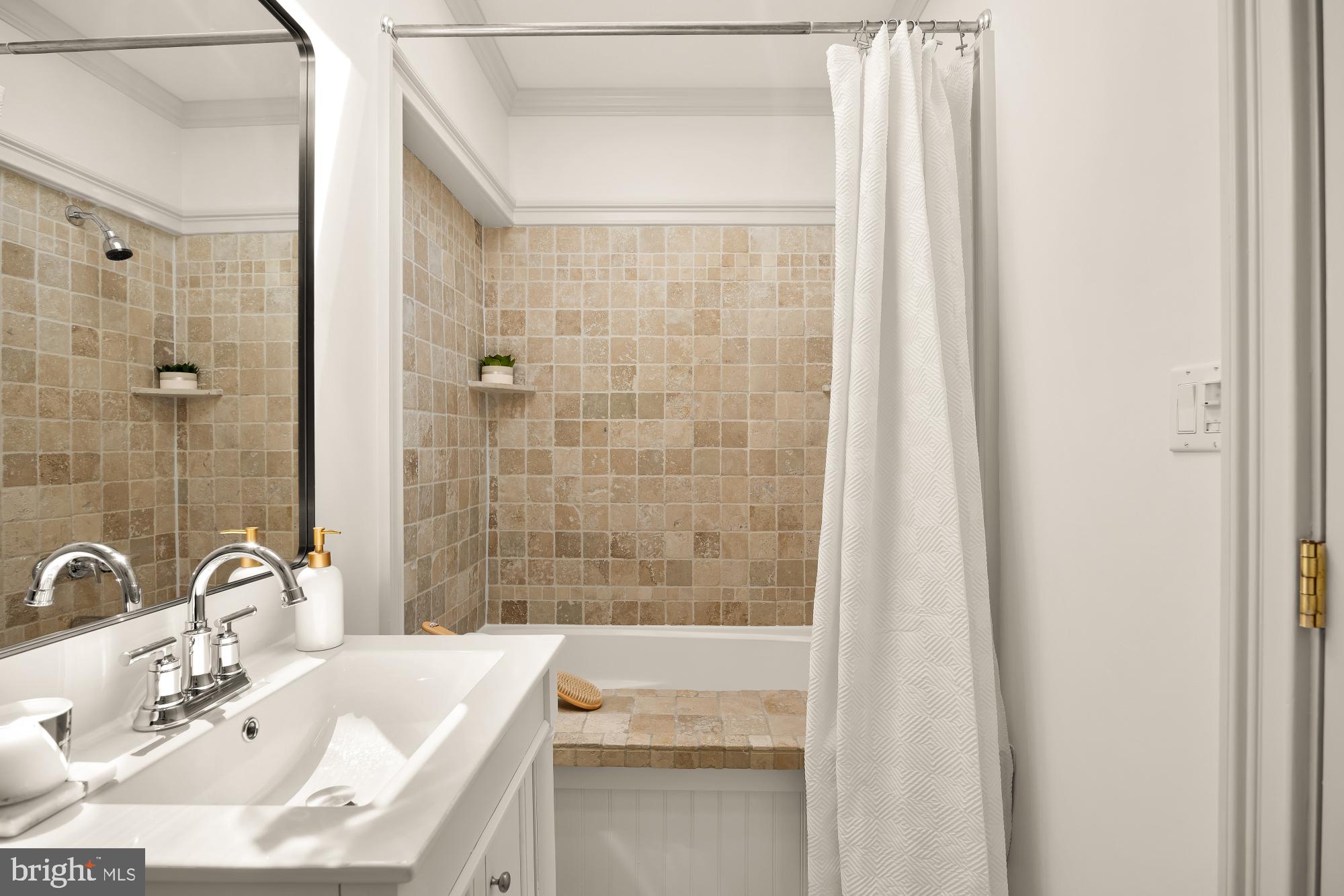 260 Warren Street Northeast Washington, DC 20002 - Photo 15 of 17 Serene bathroom with natural stone tiles.