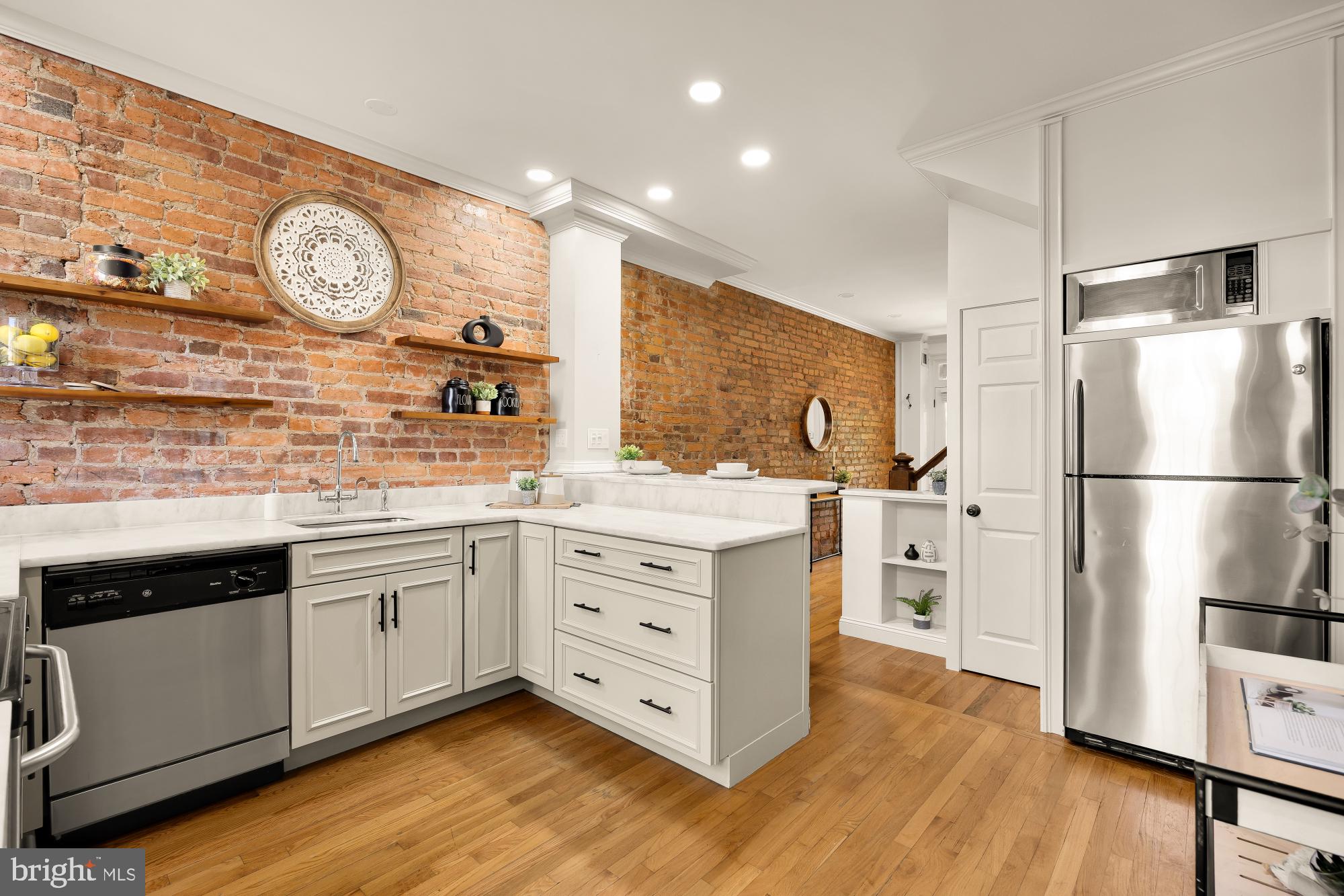 260 Warren Street Northeast Washington, DC 20002 - Photo 10 of 17 Chic kitchen with exposed brick charm.