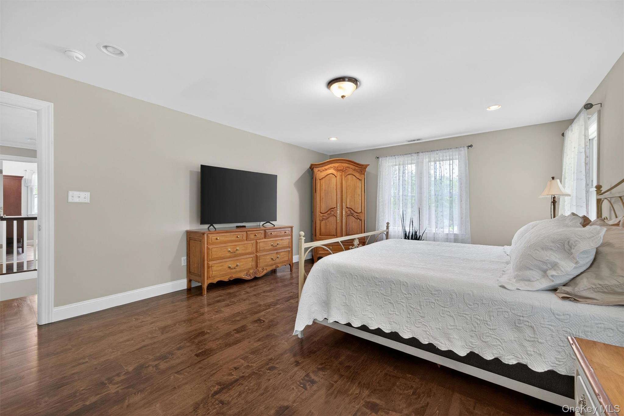 28 Bethlehem Road New Windsor, NY 12553 - Photo 31 of 50 a bedroom with a bed and a flat screen tv
