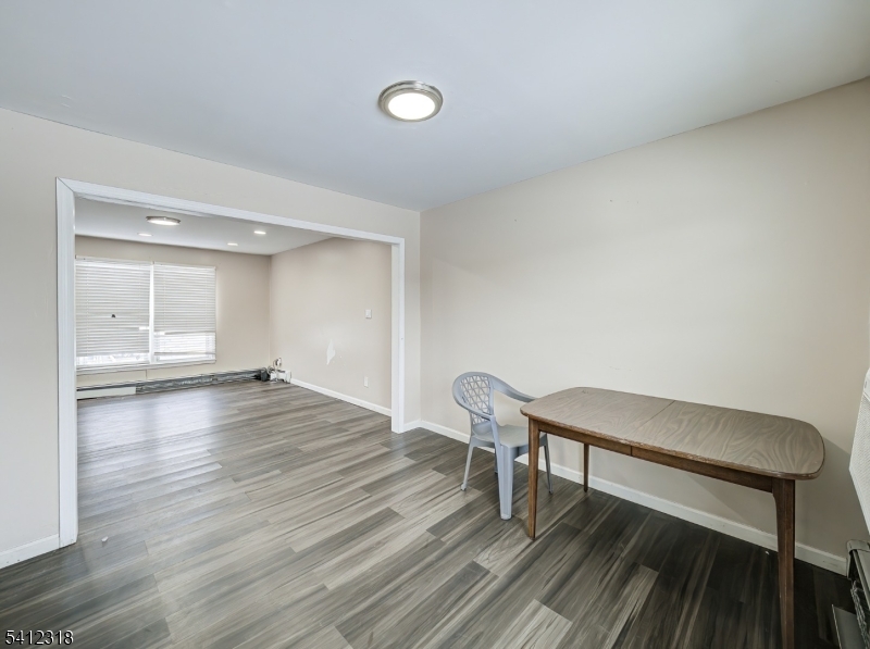 42 Mercer Street Carteret, NJ 07008 - Photo 17 of 35 a view of a room with wooden floor lounge chair and a fireplace