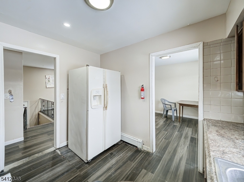 42 Mercer Street Carteret, NJ 07008 - Photo 19 of 35 a view of kitchen with furniture and a refrigerator
