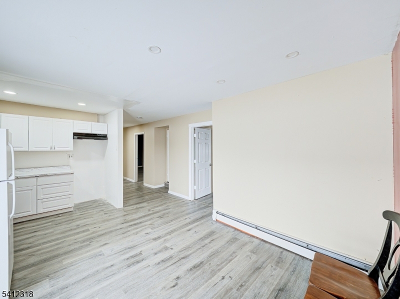 42 Mercer Street Carteret, NJ 07008 - Photo 31 of 35 a view of empty room with wooden floor
