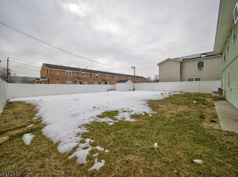 42 Mercer Street Carteret, NJ 07008 - Photo 6 of 35 a swimming pool with yard and mountain in the background