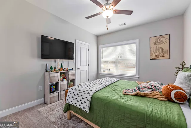 a spacious bathroom with a double vanity sink and a mirror