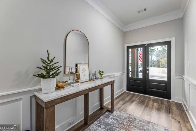 a view of kitchen with a sink and wooden floor