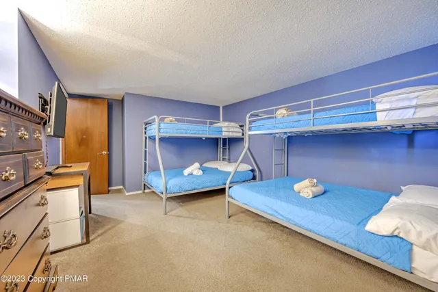 a room with wooden cabinets and couch