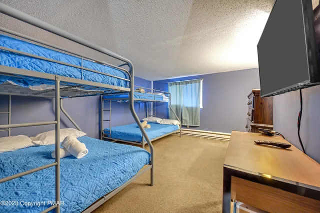 a bed room with furniture and a window