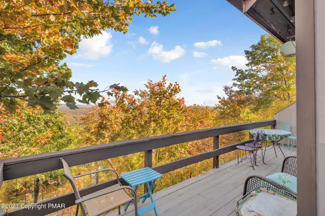a view of a balcony with chairs