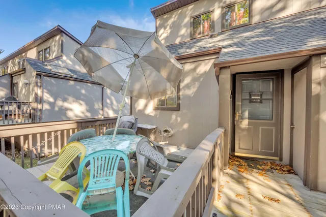 a view of balcony with furniture