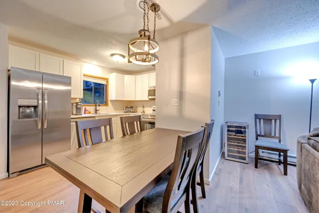 a kitchen with cabinets and stainless steel appliances