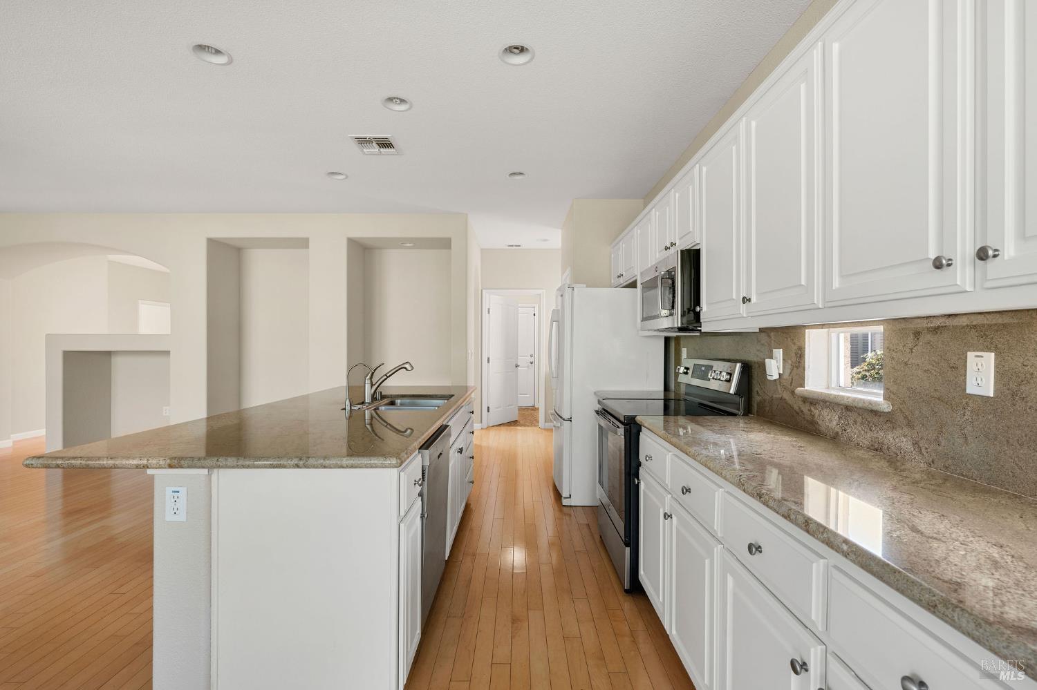 505 Marianna Place Rio Vista, CA 94571 - Photo 11 of 33 a kitchen with stainless steel appliances granite countertop a sink stove and refrigerator