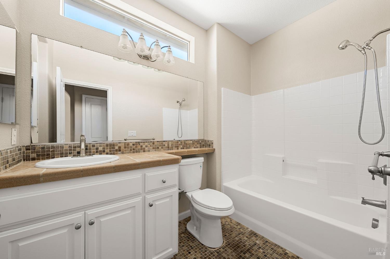 505 Marianna Place Rio Vista, CA 94571 - Photo 24 of 33 a bathroom with a granite countertop sink a toilet and a bathtub