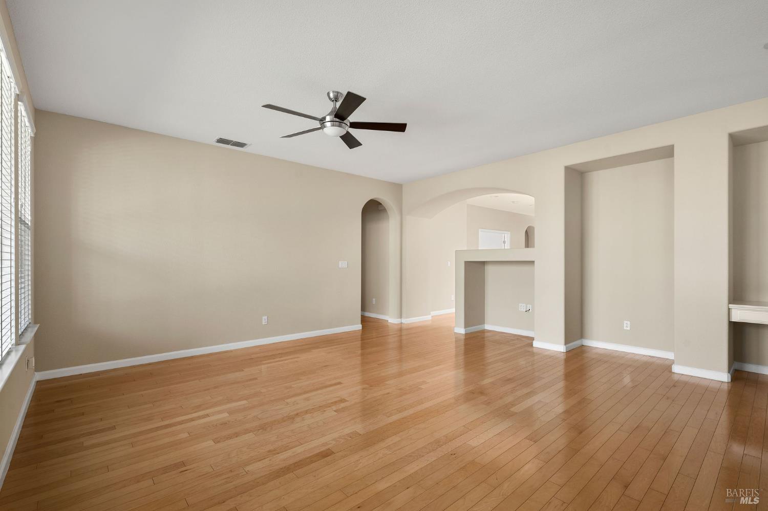 505 Marianna Place Rio Vista, CA 94571 - Photo 6 of 33 a view of empty room with wooden floor and ceiling fan