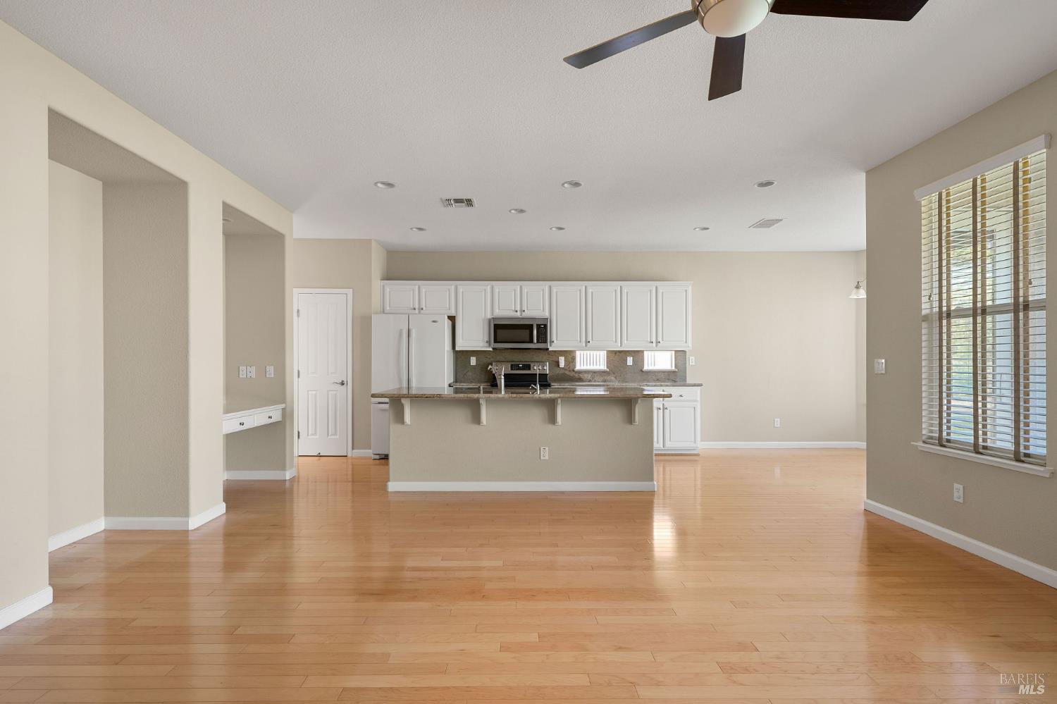 505 Marianna Place Rio Vista, CA 94571 - Photo 8 of 33 a view of a kitchen with stainless steel appliances wooden floor and a window