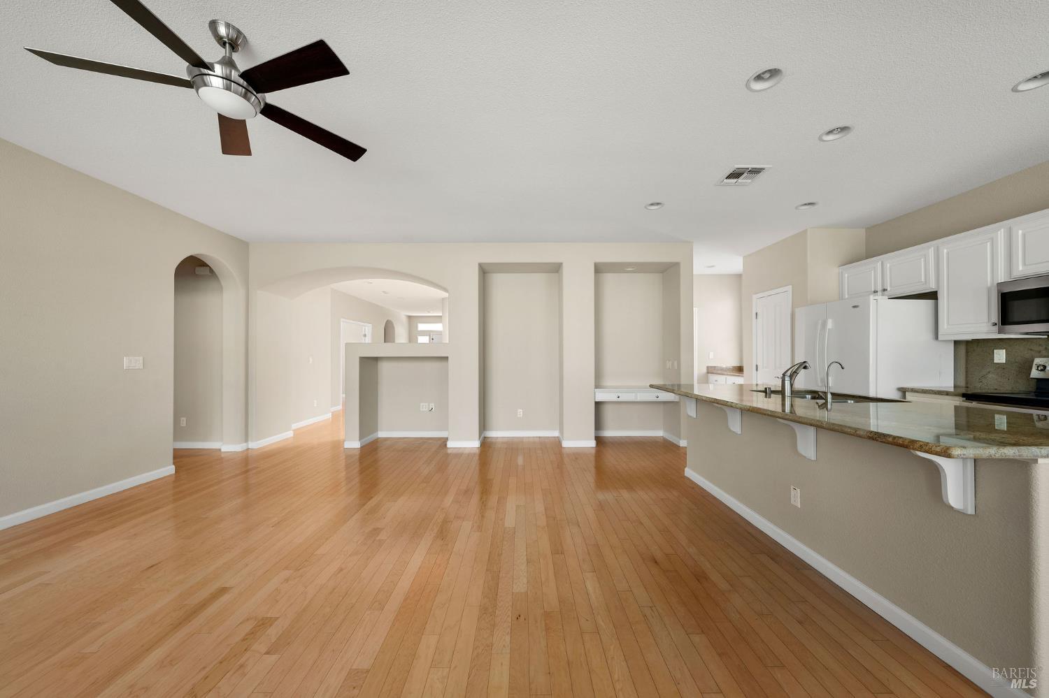 505 Marianna Place Rio Vista, CA 94571 - Photo 10 of 33 a view of empty room with wooden floor and window