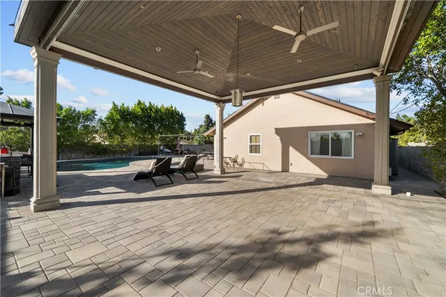 a view of a house with backyard and porch