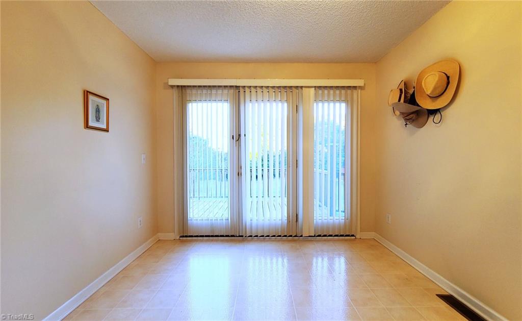 2301 Griffith Road Winston-Salem, NC 27103 - Photo 15 of 50 Room/office area looking out to the back deck.