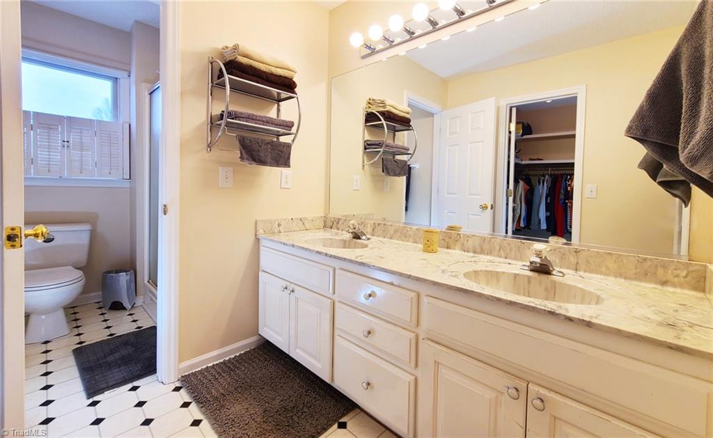 2301 Griffith Road Winston-Salem, NC 27103 - Photo 20 of 50 Toilet room and shower with natural light.