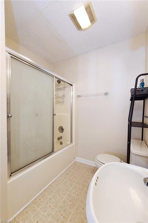 2301 Griffith Road Winston-Salem, NC 27103 - Photo 25 of 50 Bath tub, toilet and pedestal sink on one side of the shared bathroom