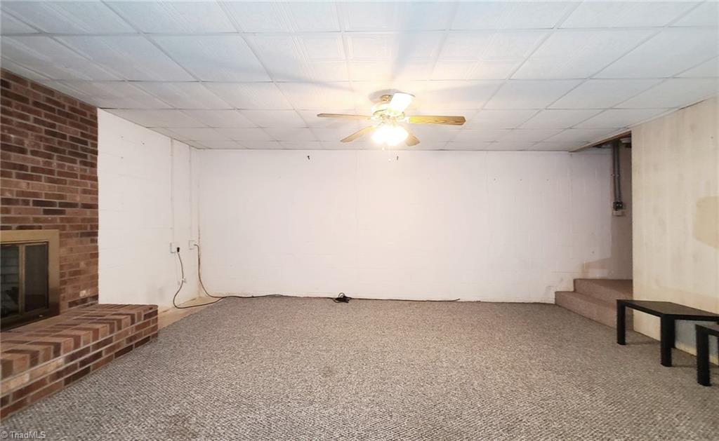 2301 Griffith Road Winston-Salem, NC 27103 - Photo 31 of 50 Heated basement area with gas logs fireplace