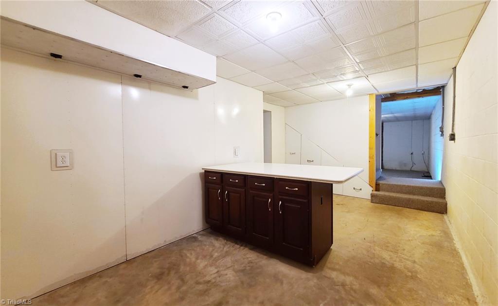 2301 Griffith Road Winston-Salem, NC 27103 - Photo 34 of 50 Partially finished basement area with bar